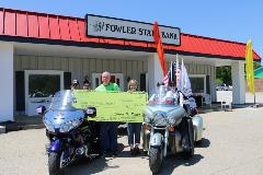 Rolling Thunder Employees present check to Rolling Thunder